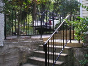 Gate with railing and candle holders