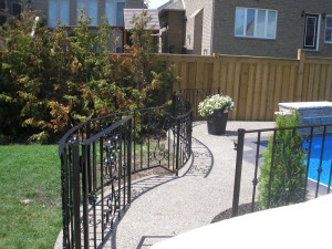 Curved fence with latch gate