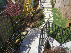 Metal railing with curved top gate